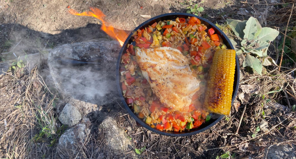 Spicy fried rice, chicken and corn on the cob.