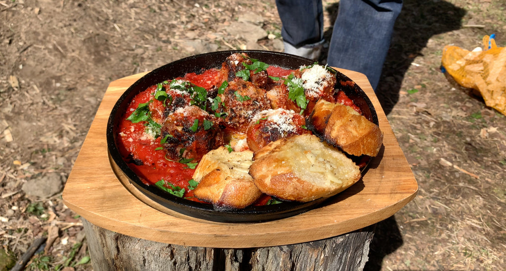 Meatballs and tomato sauce with crusty garlic bread. 